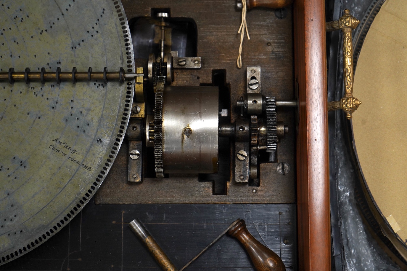 A walnut cased Orphenion, the replacement case is understood to have been constructed from panels from RMS Mauretania, 64cm wide, 49cm deep, 23cm high, with twenty-two 41cm diameter discs. Condition - good.